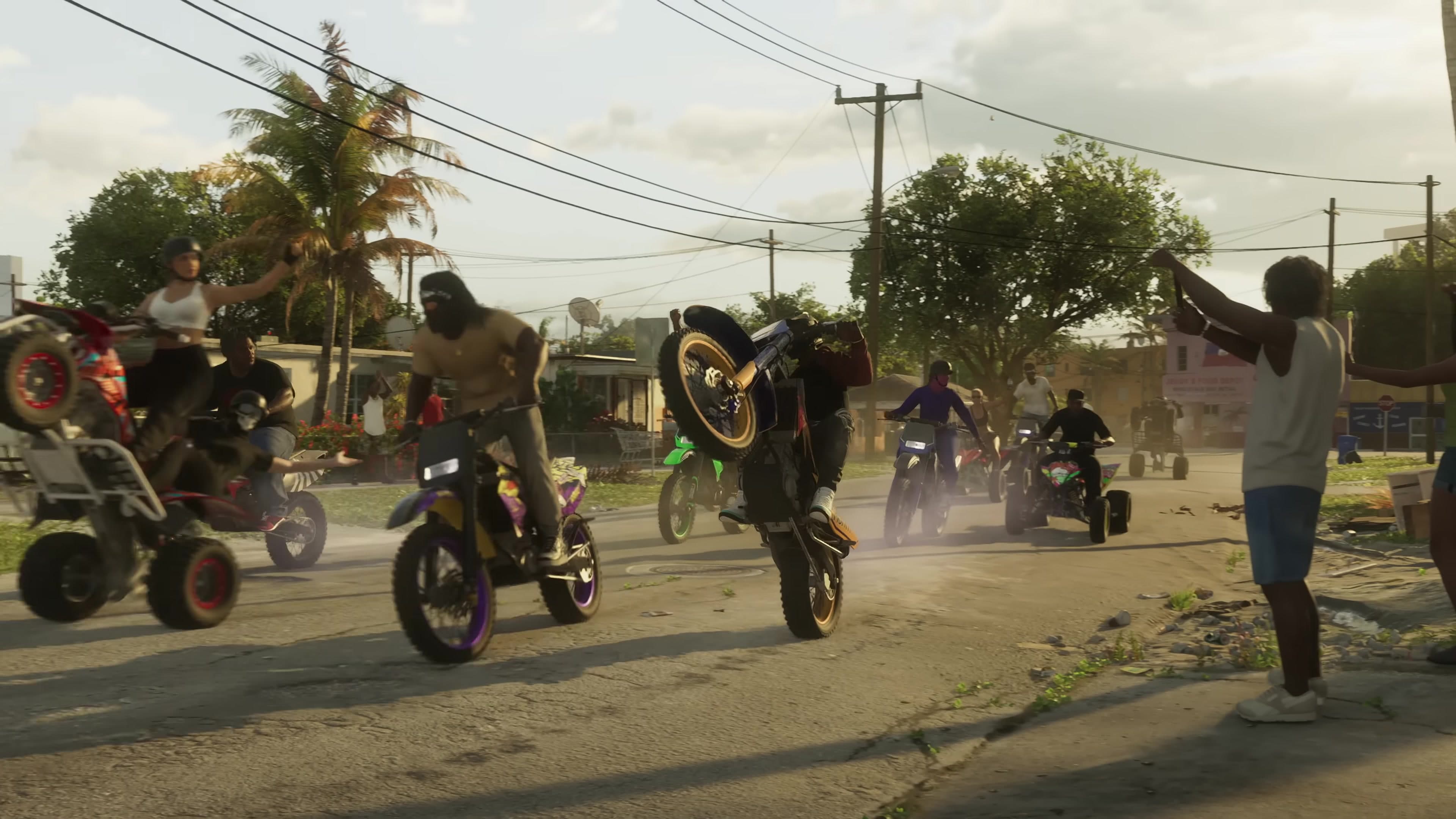 Dirt bikes / ATVs doing wheelies down a dusty street