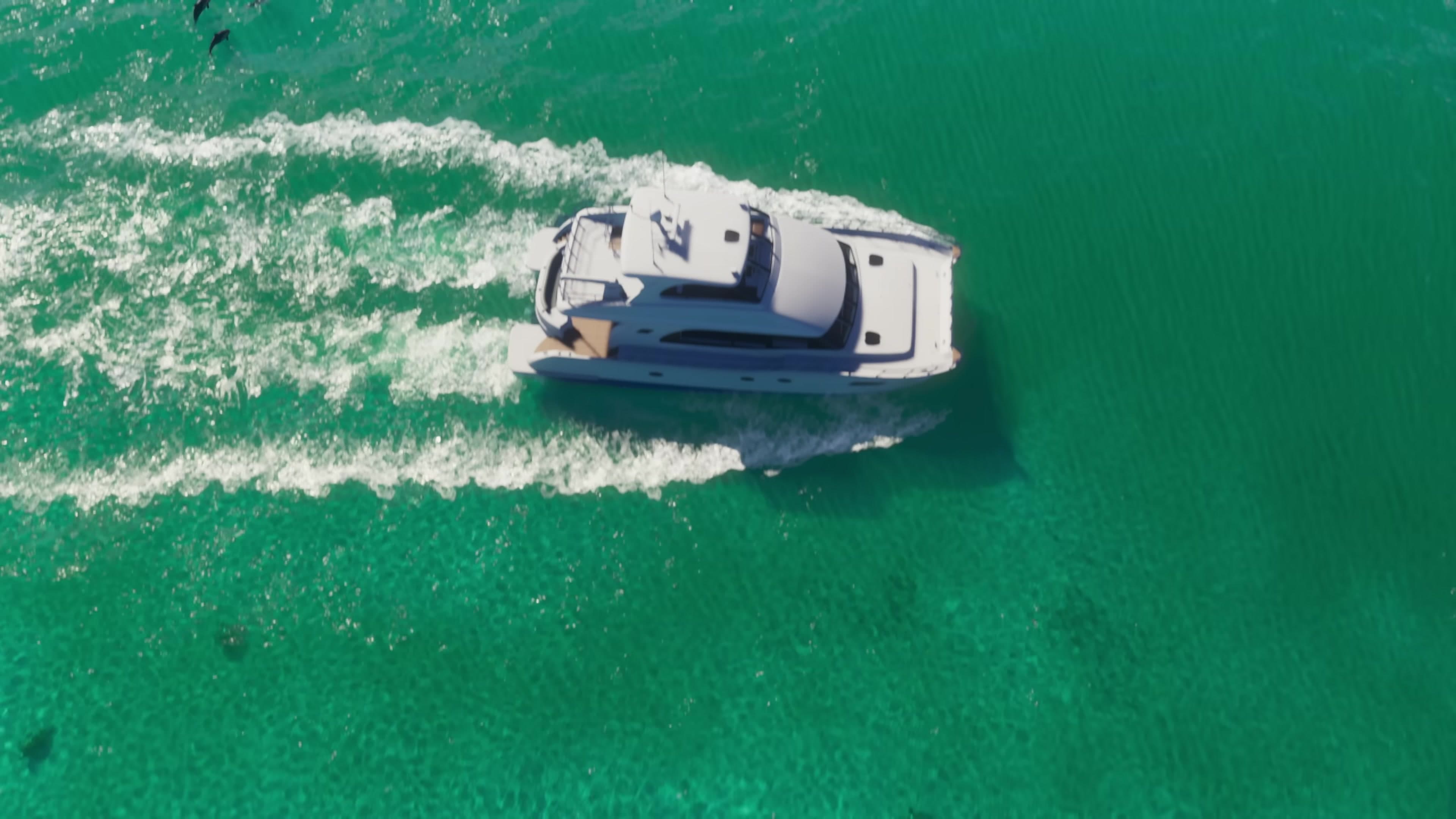 Aerial speedboat on turquoise water near the coast