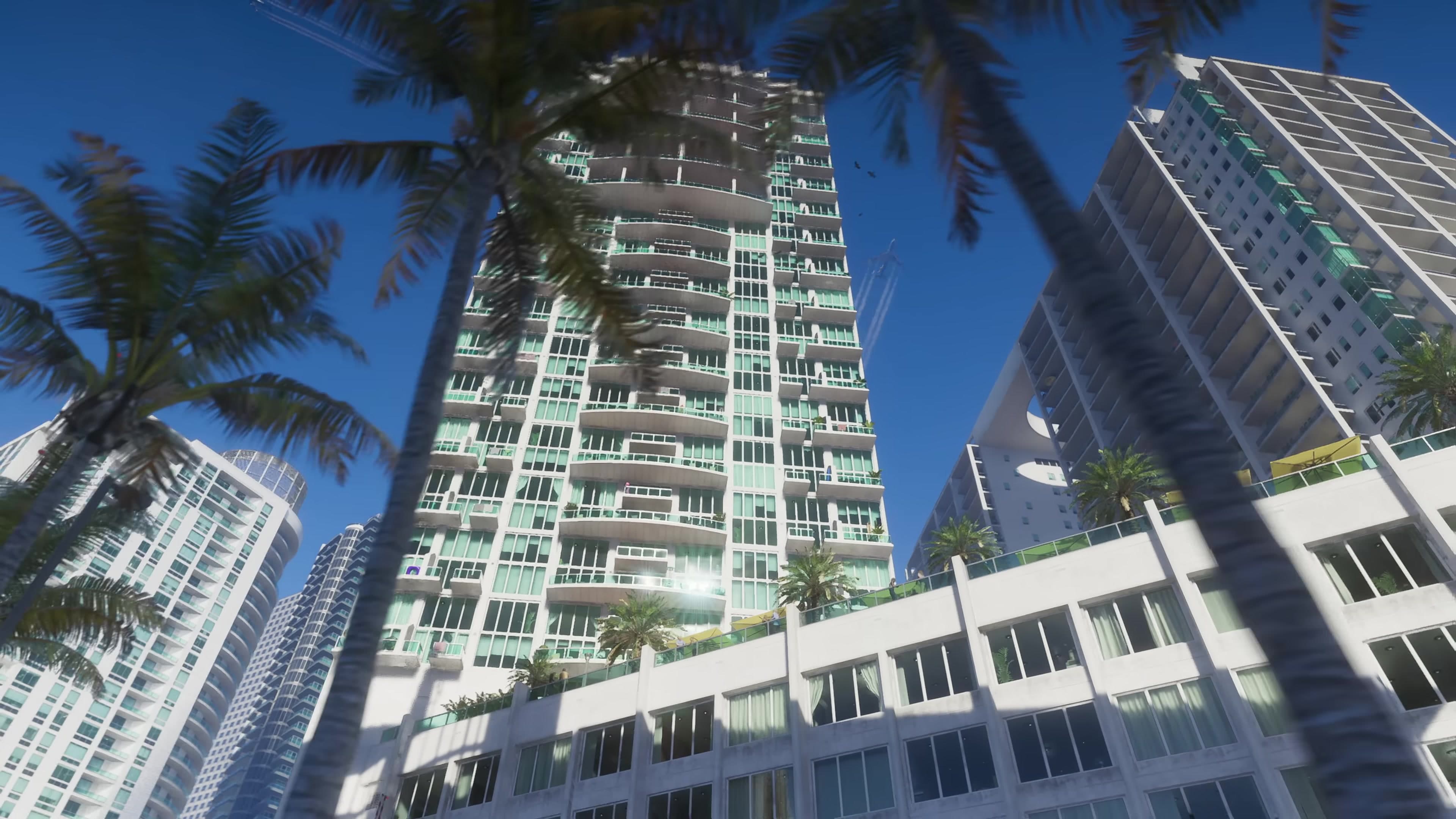 Upward shot of beachfront towers and palms